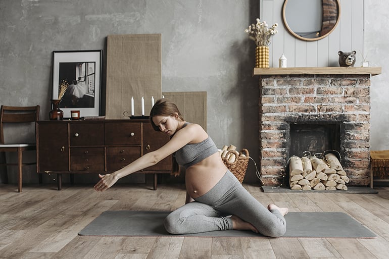 family planning pregnant woman making yoga