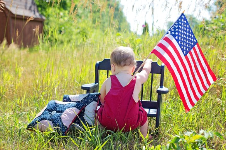 american passport baby in a chair