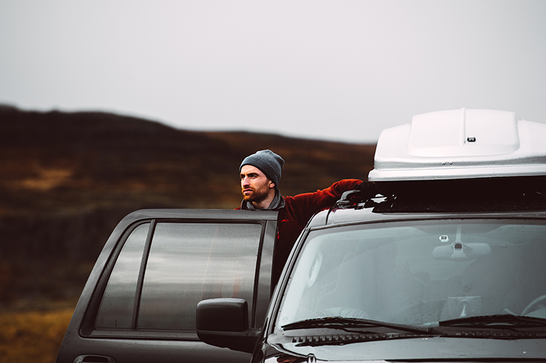 Man in his car thinking of an international driver's license in Spain