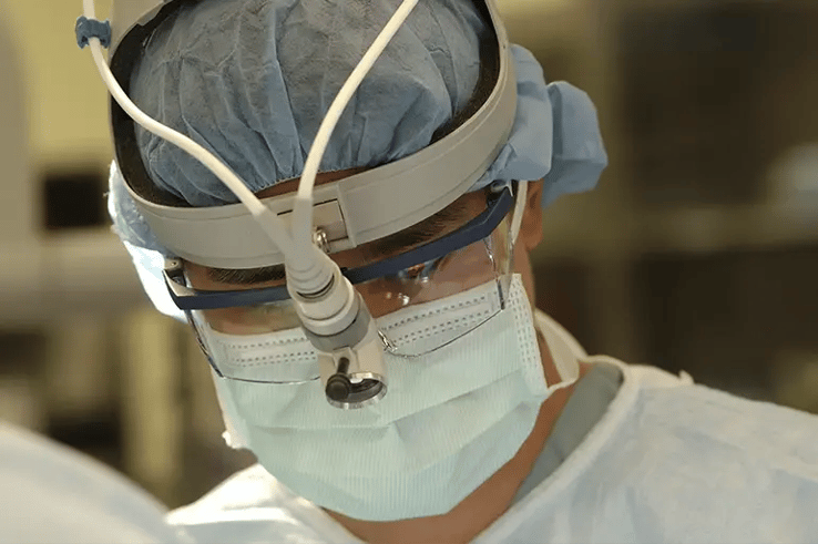Surgeon performing eye surgery