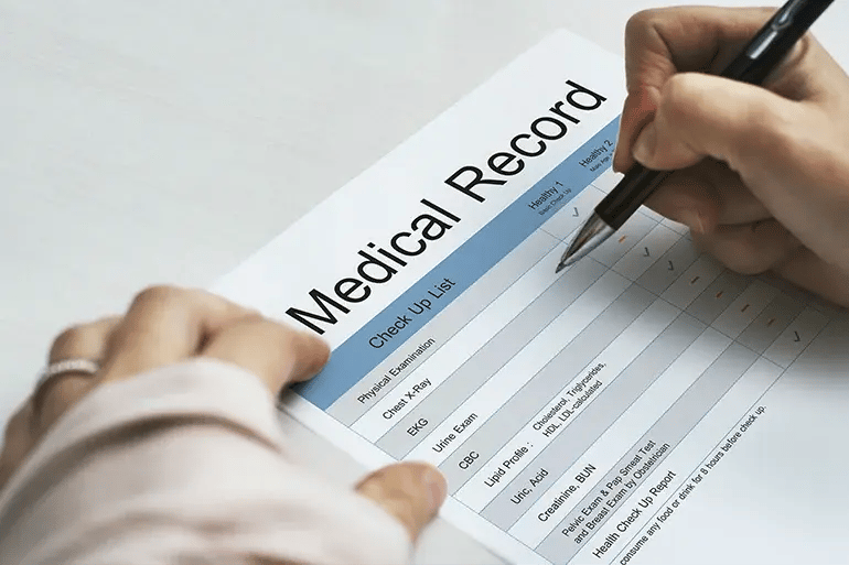 a person filling out a medical form