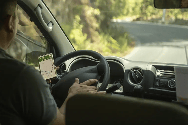 man driving a car guided by Google Maps