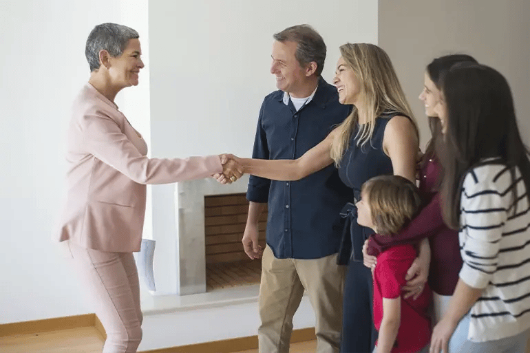 a family signing the agreement when buying their new home