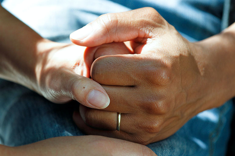 holding hands during emergency in Spain