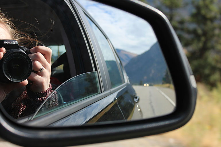 girl taking a picture on spanish toll roads