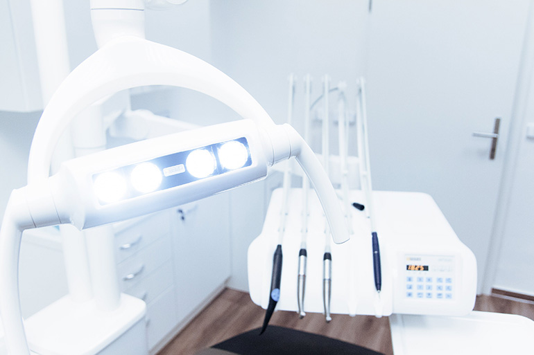 dentist chair where they fix damaged tooth enamel