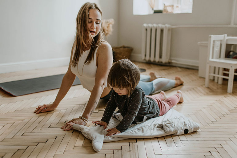 mother and daughter stretching for physiotherapy treatments
