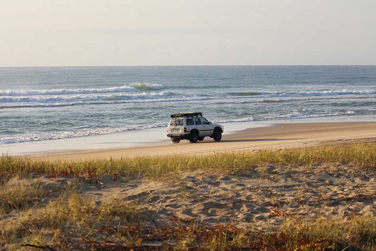 Car driving through beach with with car Insurance in Spain Comparison