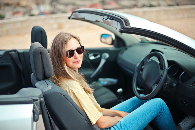 woman in car with accident detection