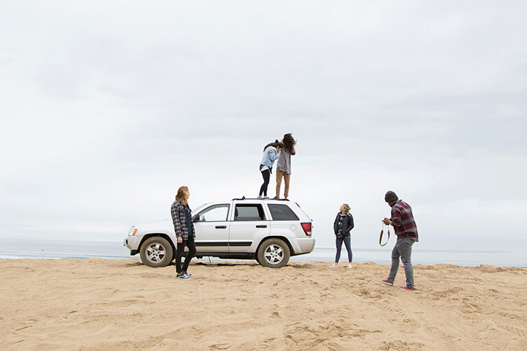 friends at the beach after registering a uk car in Spain