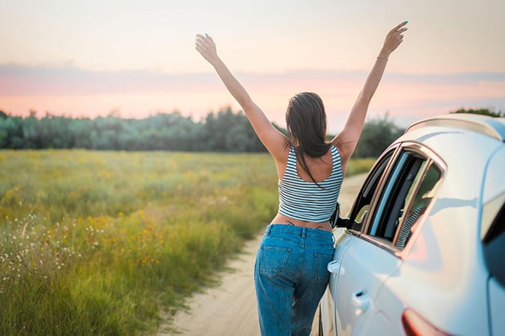 girl happy about making an insurance claim on her car 