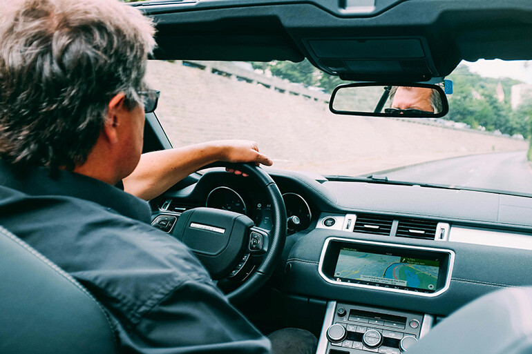 man driving thinking on car theft claim process in spain