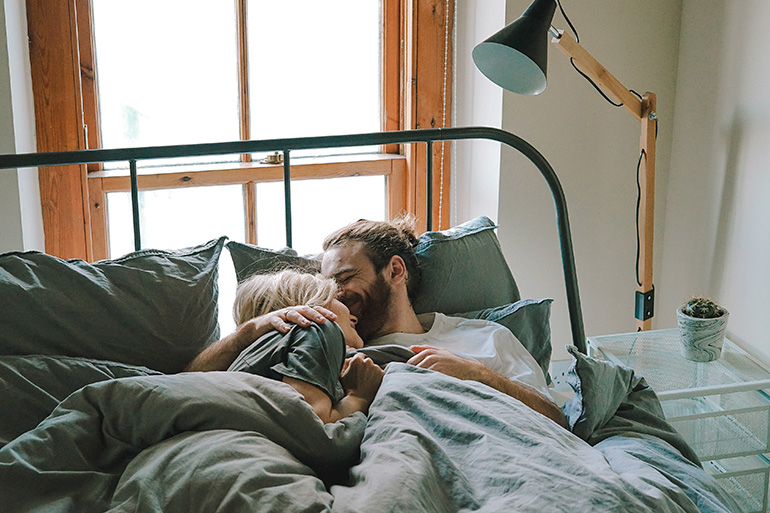 couple wondering when to go to the doctor for a fever, cold or cough