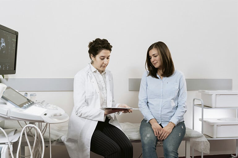 A pregnant woman asking how much does a pregnancy ultrasound cost without insurance.