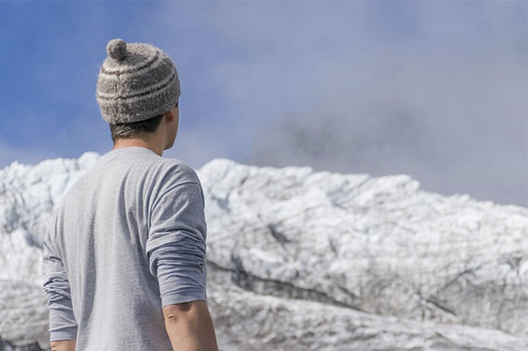 A guy who has reached his destination by following road safety tips for snow and winter.
