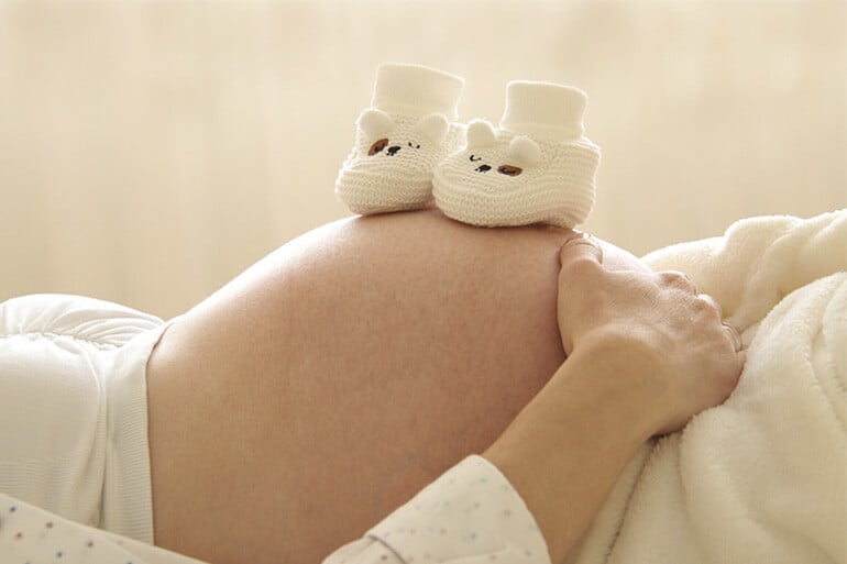 A pregnant woman after finding out how much a pregnancy ultrasound costs without insurance.