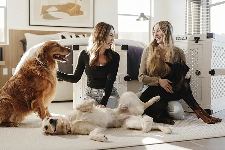 Two relaxed dog owners after purchasing their Dangerous Dog Insurance