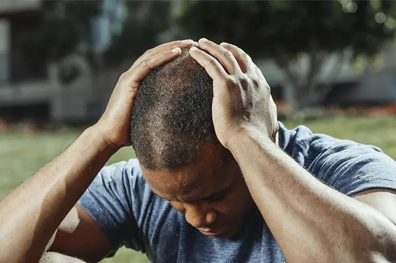 A mansuffering from one of the most common health problems.