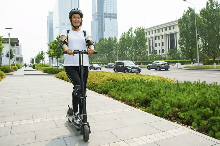 A woman feeling at ease after getting her Electric Scooter Insurance.