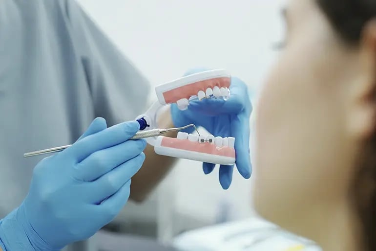 A girl at the dentist without waiting after getting her full coverage dental plan.