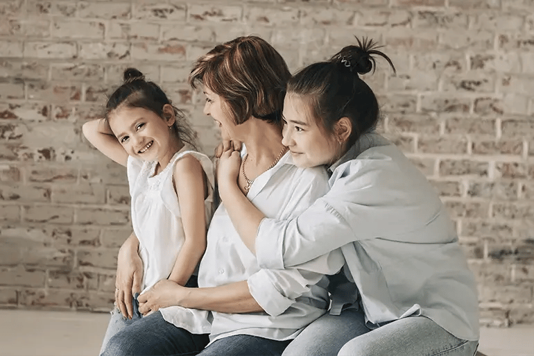 A relaxed family after finding out the average cost of health insurance for a family of 3.