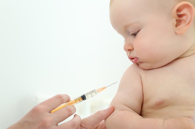 flu vaccine for babies in Spain, baby being vaccinated