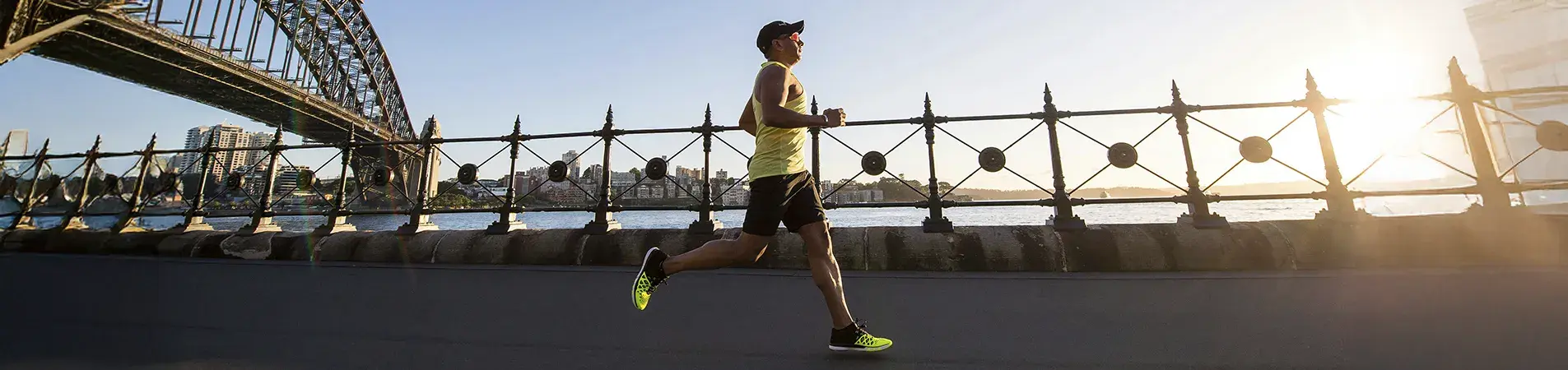 a man running along a bridge