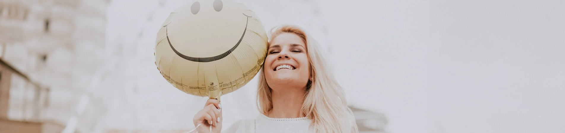 woman smiling because of orthodontic coverage