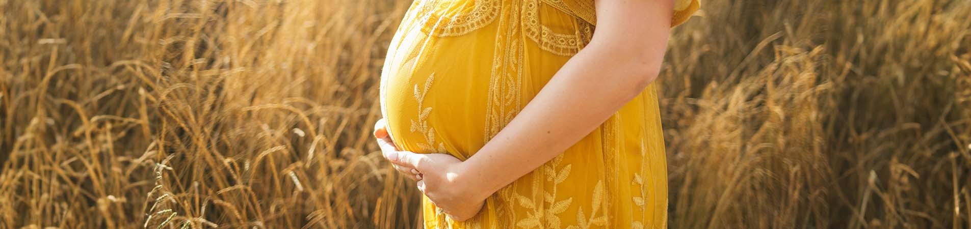 pregnant woman contemplating different types of artificial insemination