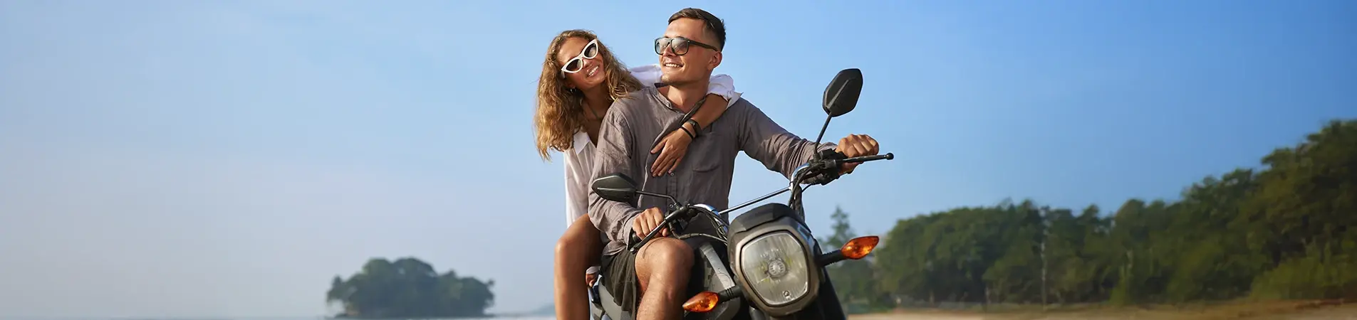 A safe couple after securing their motorcycle accident insurance coverage.