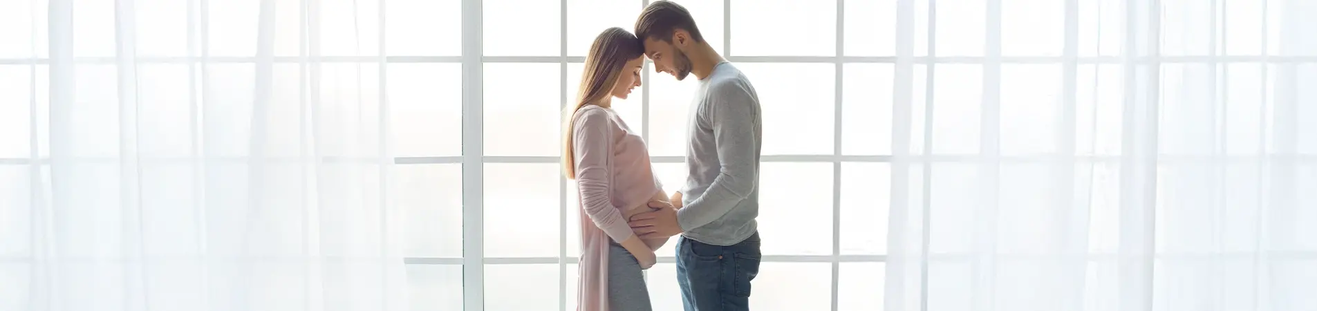 A couple looking for good maternity health insurance.