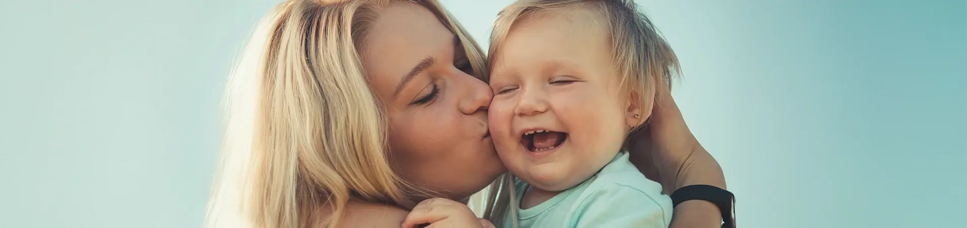 A happy mom after learning everything about the baby vaccination card.