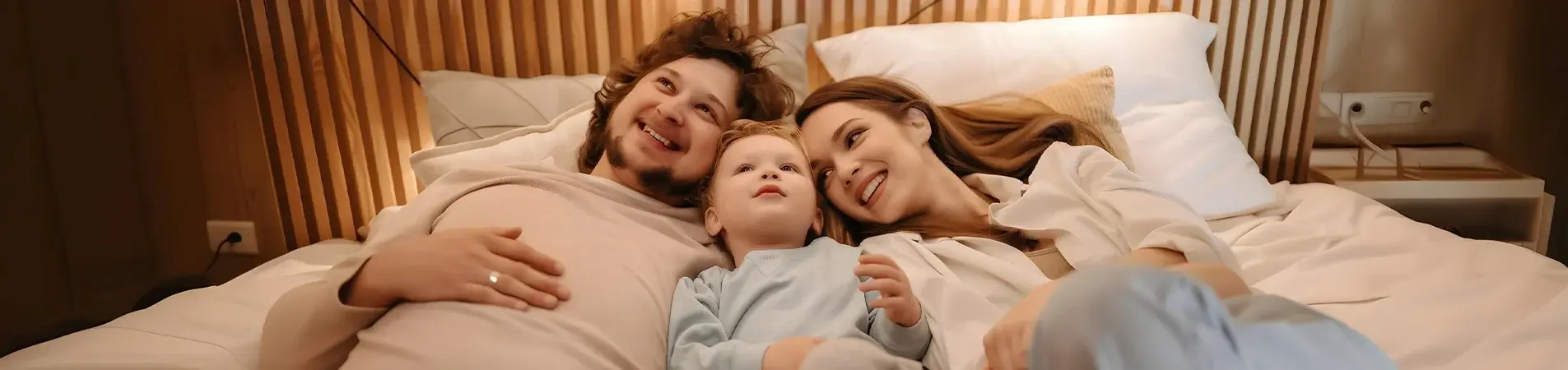 A happy family after finding out the average cost of health insurance for a family of 3.