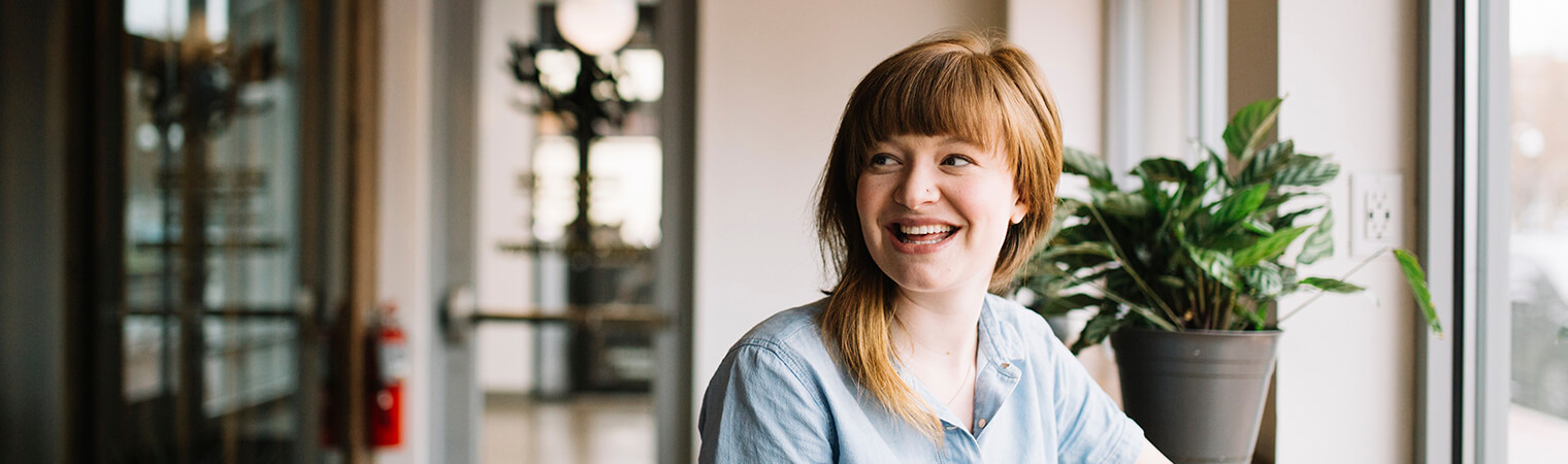 woman smiling about dental insurance